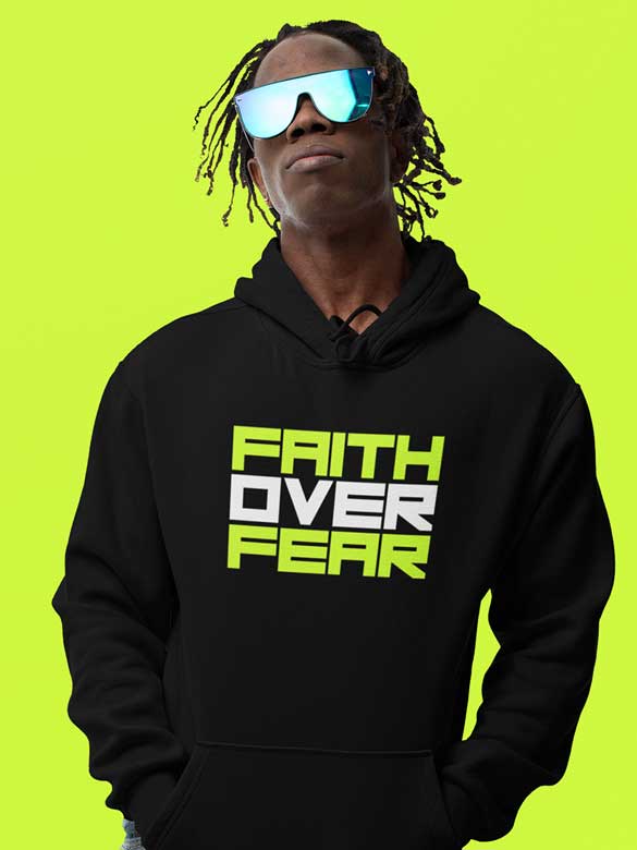 Man wearing Black Hoodie with quote "Faith Over Fear"