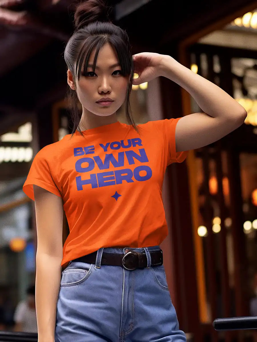 Woman wearing BE YOUR OWN HERO - Women's Orange Cotton T-Shirt 