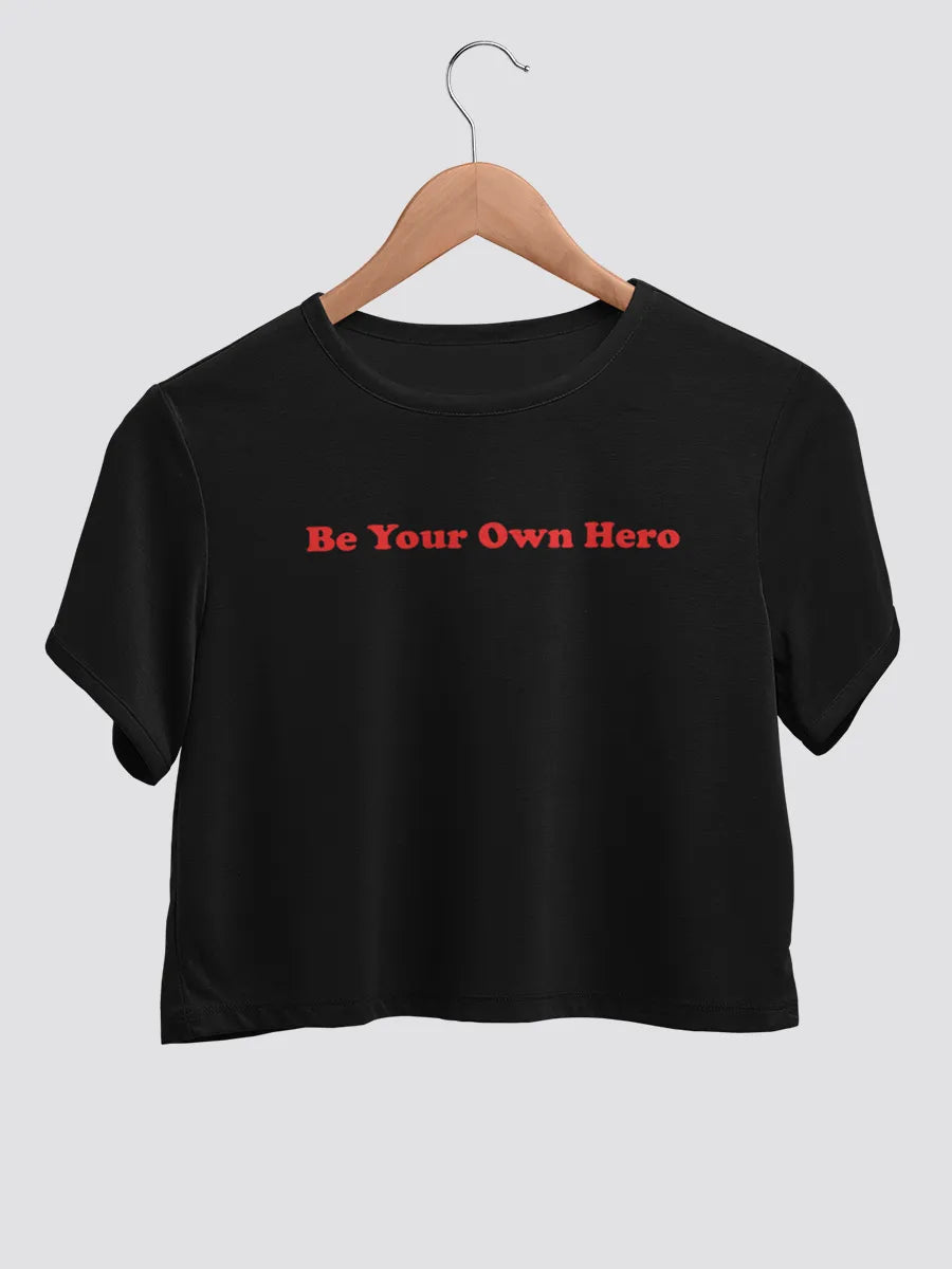 Black cotton crop top with text "Be your own hero "