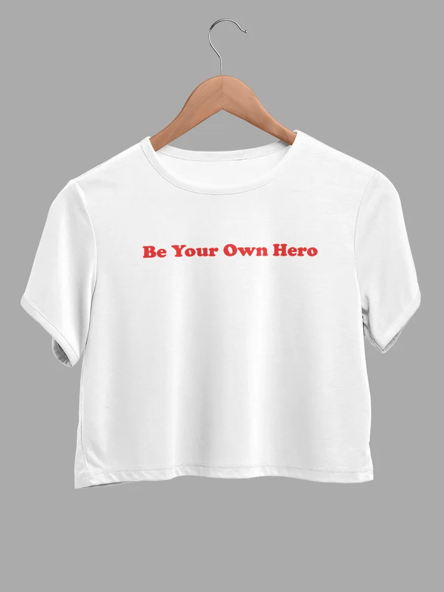 white cotton crop top with text "Be your own hero "