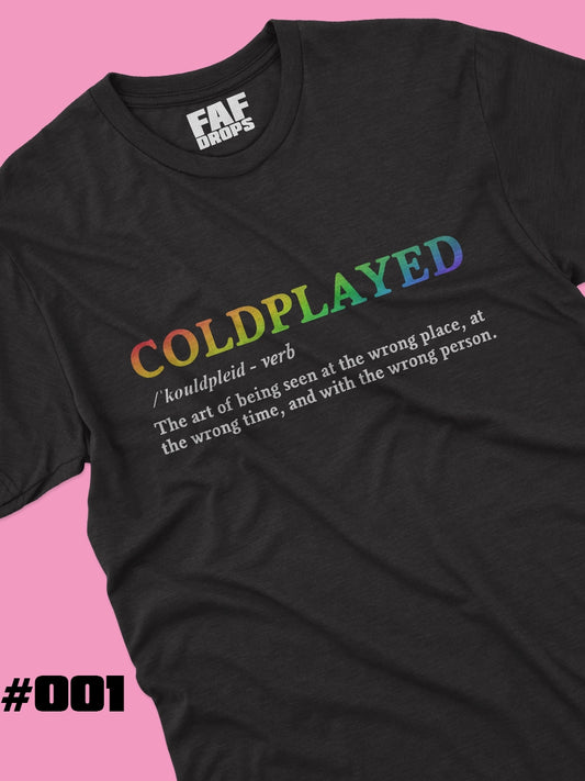 Black t-shirt with colorful 'COLDPLAYED' text and FAF DROPS branding on a pink background.