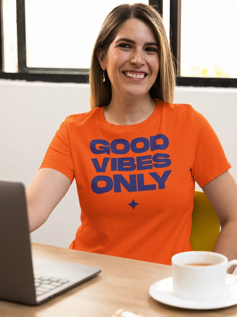 Woman wearing GOOD VIBES ONLY- Women's Orange Cotton T-Shirt 