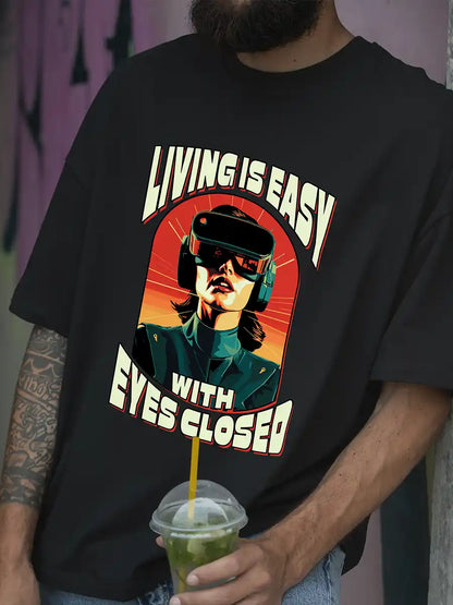 Man wearing Living is EASY with eyes Closed - Black  Oversized T-Shirt