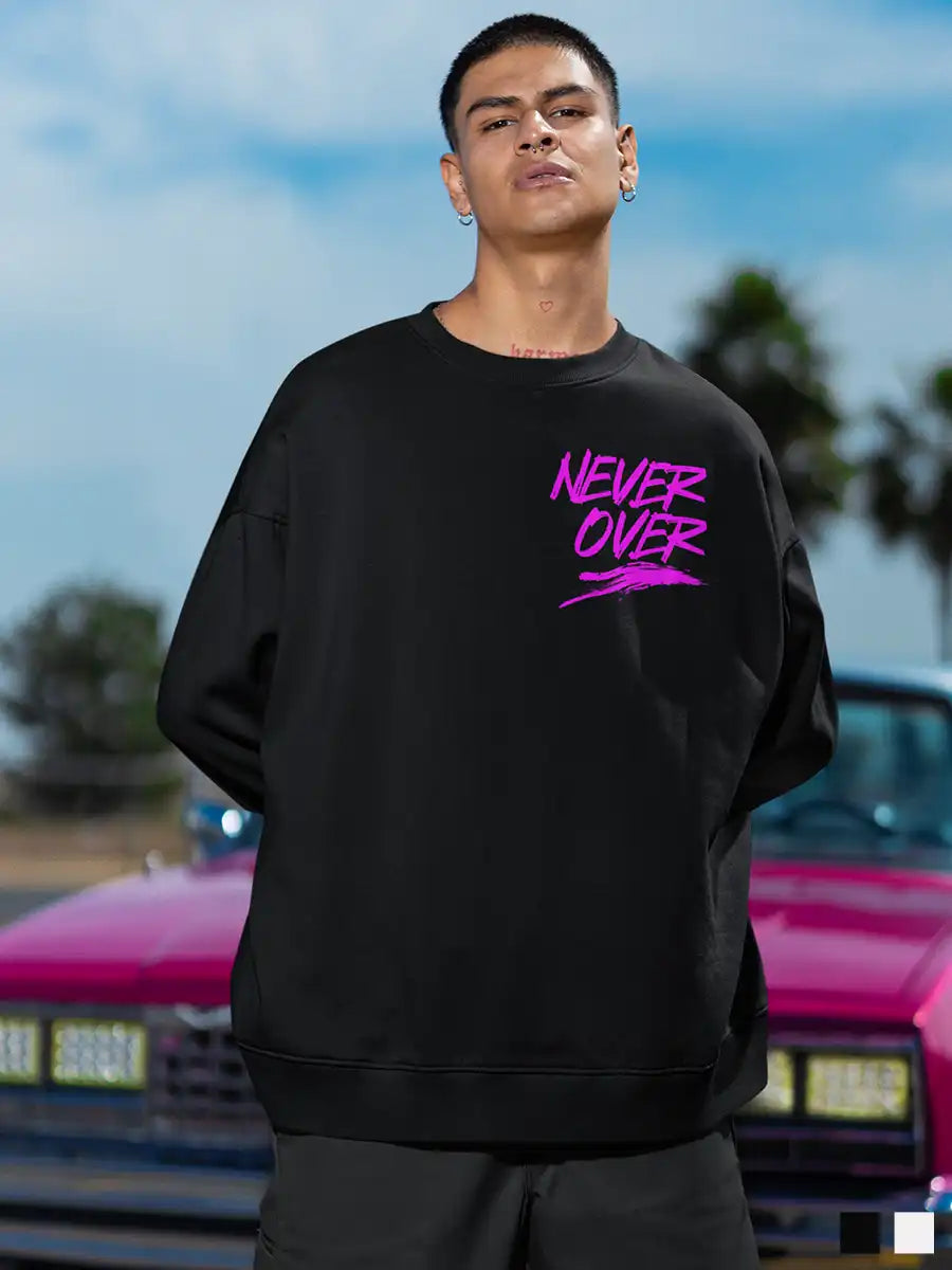 Man wearing Never Over Black sweatshirt