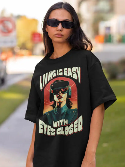 Woman wearing Living is EASY with eyes Closed - Black  Oversized T-Shirt