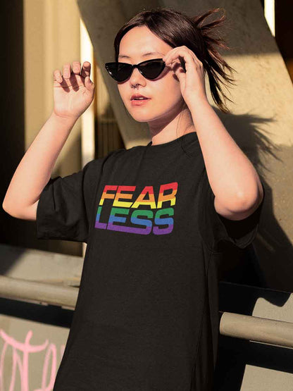 Woman wearing Black Oversized Cotton Tshirt with quote "Fearless" in PRIDE colors