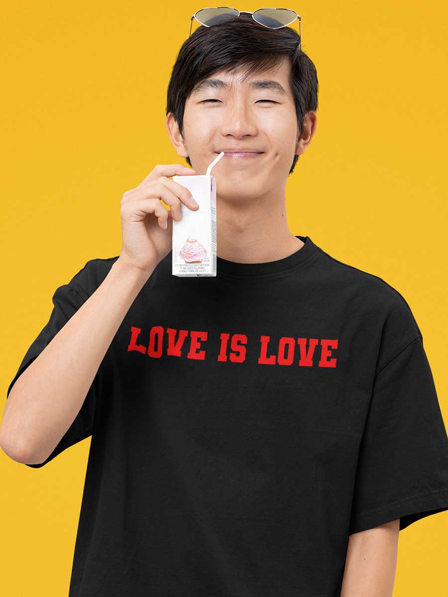 Man Wearing Black Oversized Cotton Tshirt with quote "Love is love" in red