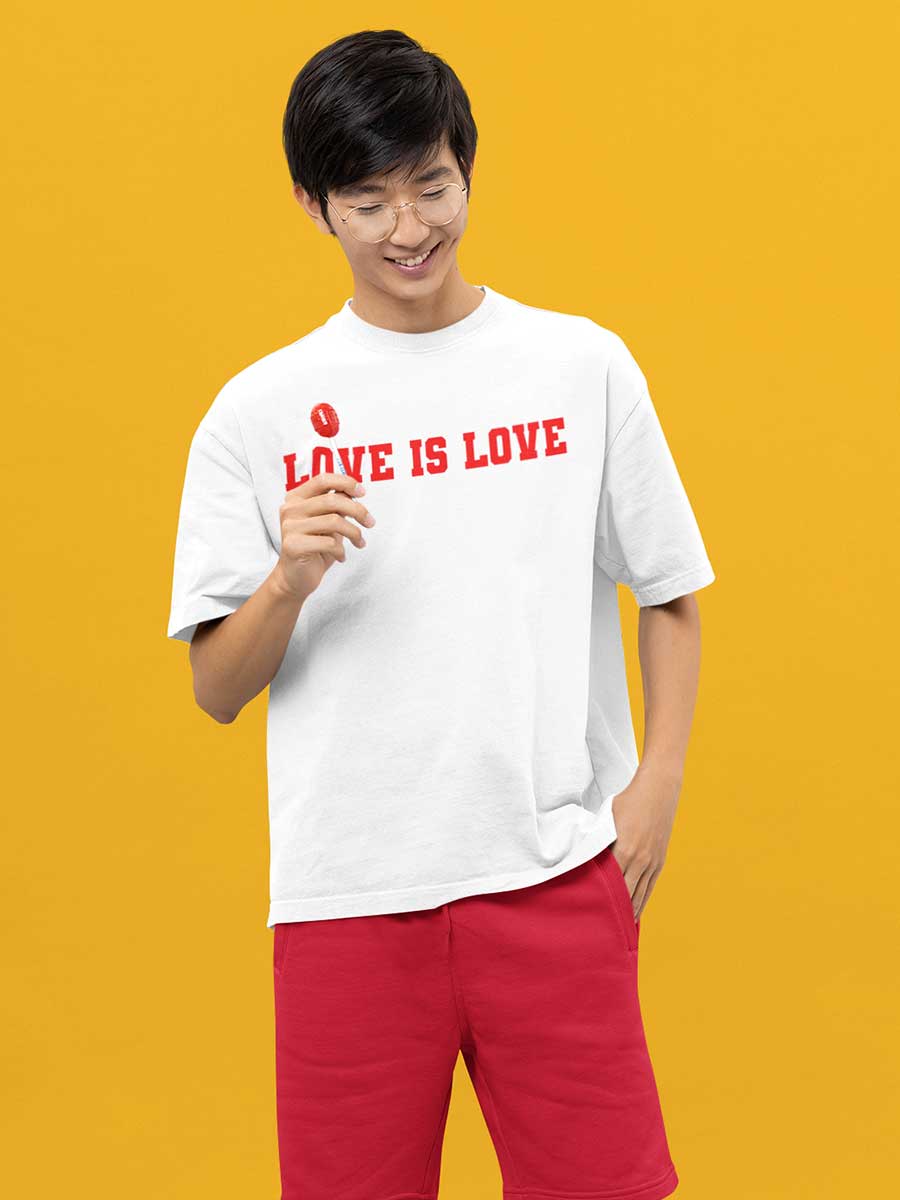 Man Wearing White Oversized Cotton Tshirt with quote "Love is love" in red