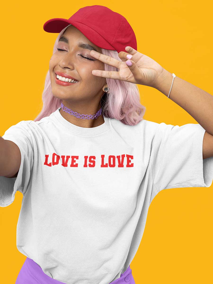 Woman Wearing White Oversized Cotton Tshirt with quote "Love is love" in red