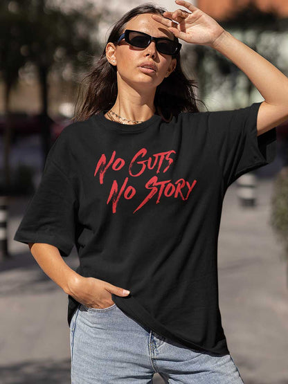 Woman wearing Black Oversized Cotton Tshirt with text "No Guts No Story" in Red