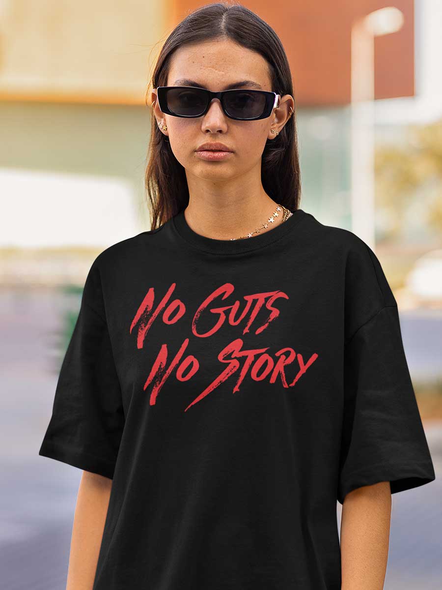 Woman wearing Black Oversized Cotton Tshirt with text "No Guts No Story" in Red