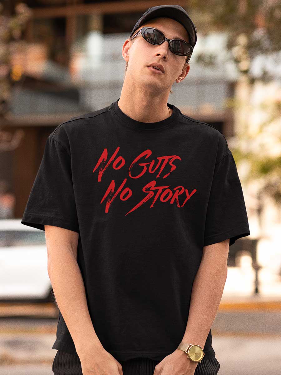 Man wearing Black Oversized Cotton Tshirt with text "No Guts No Story" in Red