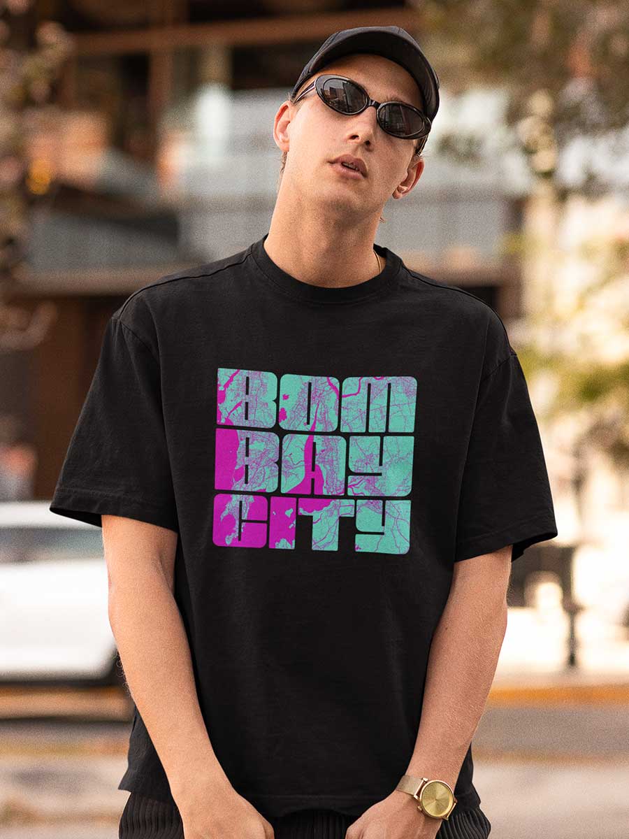 Man wearing  Black Oversized Cotton Tshirt with Bombay city written on it