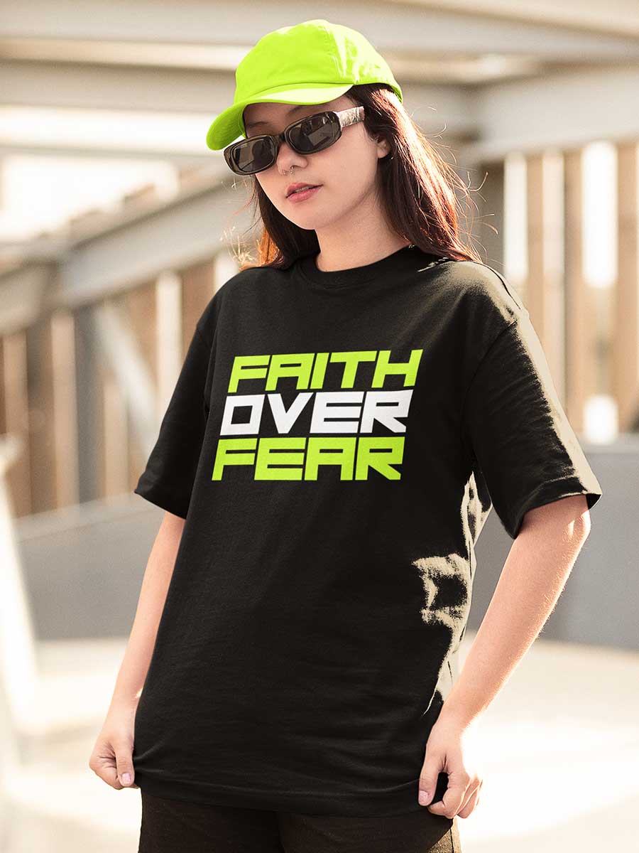 Woman wearing Black Oversized Cotton Tshirt with quote "Faith over Fear "