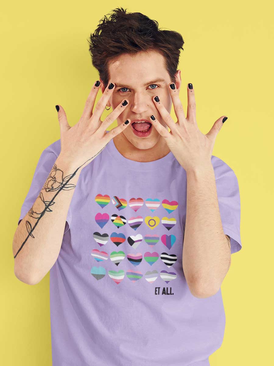 Man wearing Lavender Oversized Cotton Tshirt with 20 Pride flags in the form of hearts