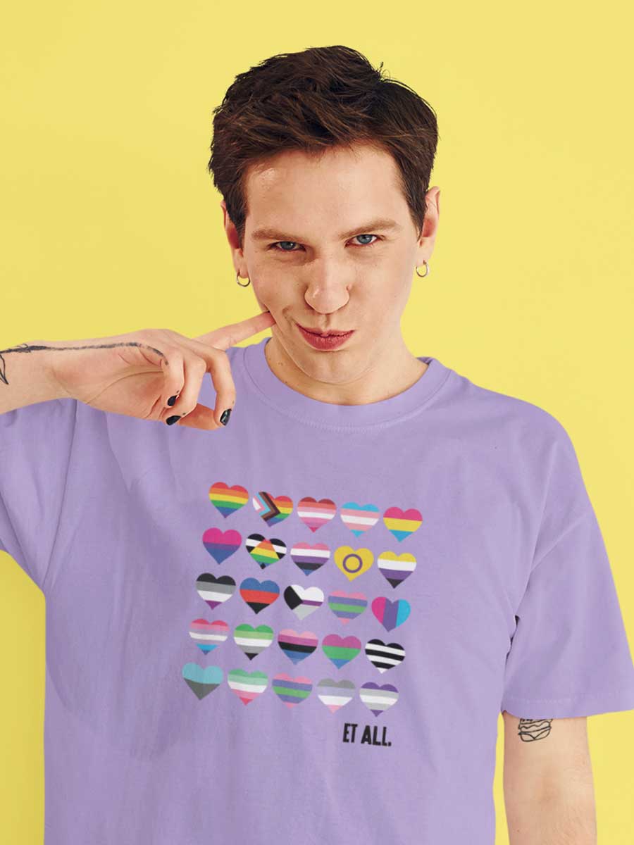 Man wearing Lavender Oversized Cotton Tshirt with 20 Pride flags in the form of hearts