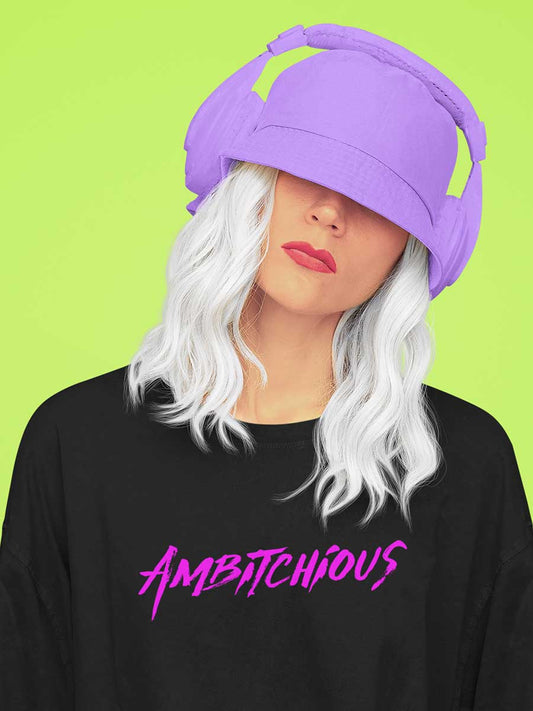 Woman wearing Black Oversized Cotton Tshirt with text "Ambitchious " in pink